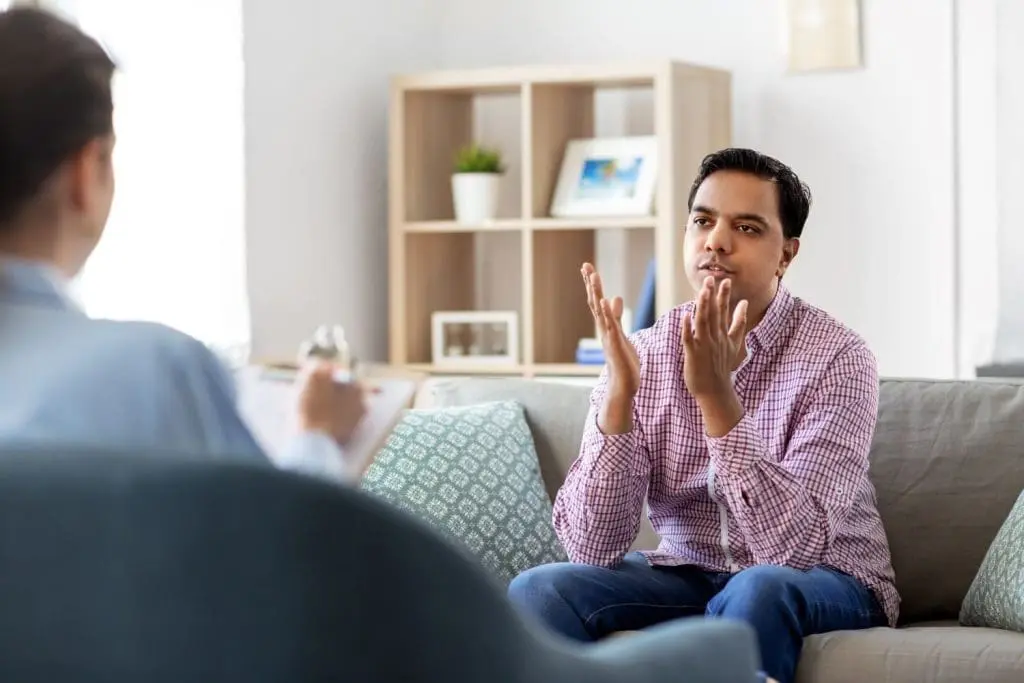Young adult man speaks with therapist wanting to understand “Can BPD be cured?” 