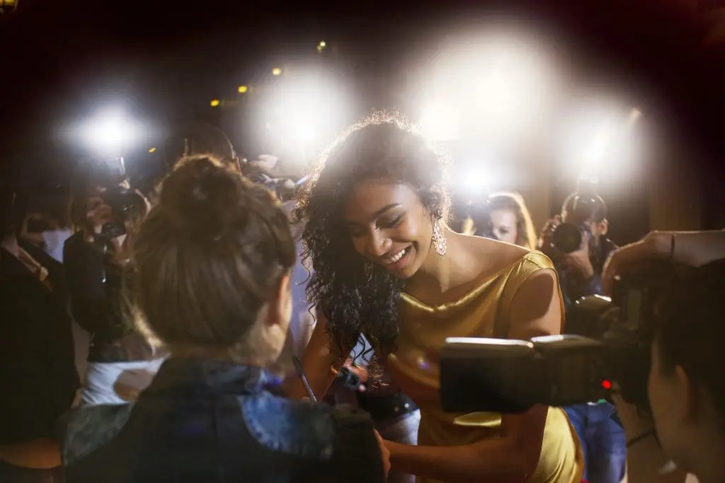 Are Celebrities Good Role Models for Teens? 1 Teen asks celebrity role model for autograph after concert.