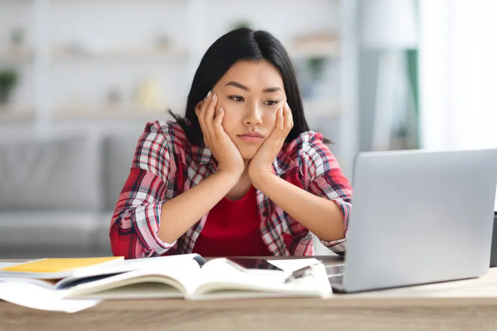 College student learning how to get help with mental health issues like anxiety and depression.