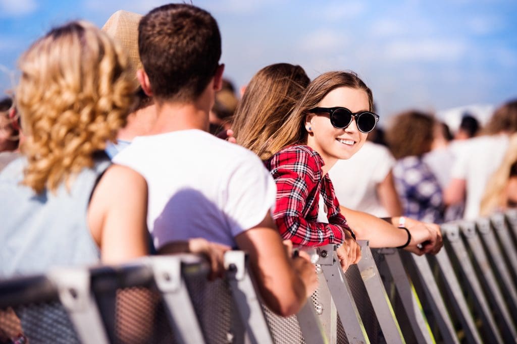 Teen who believes celebrities are good role models waits in line for a concert.