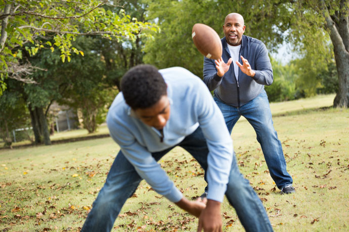 Teen fighting technology addiction enjoys outdoor activities with dad. 