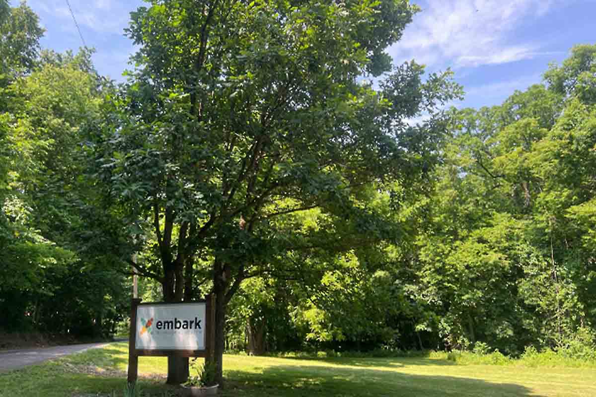 Exterior Embark Behavioral Health sign at residential treatment program in Independence, Missouri.