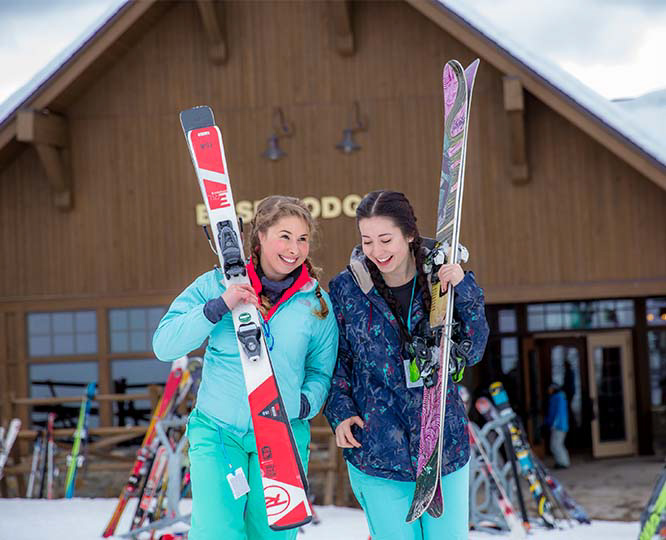 Girls in therapeutic boarding school feeling relief from anxiety on healing ski trip.