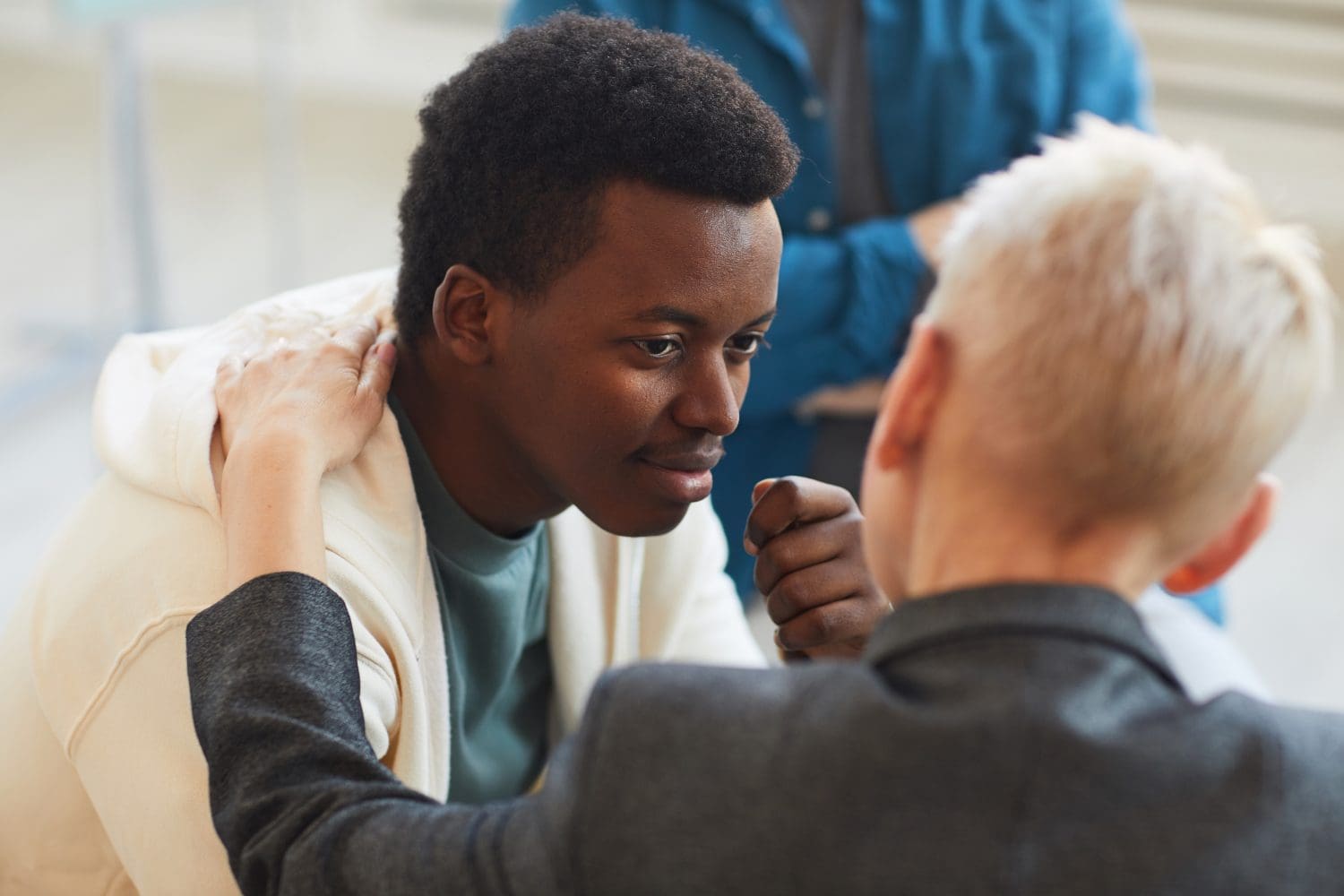 Therapist at Embark Behavioral Health using a therapeutic approach to connect with a teen in treatment.