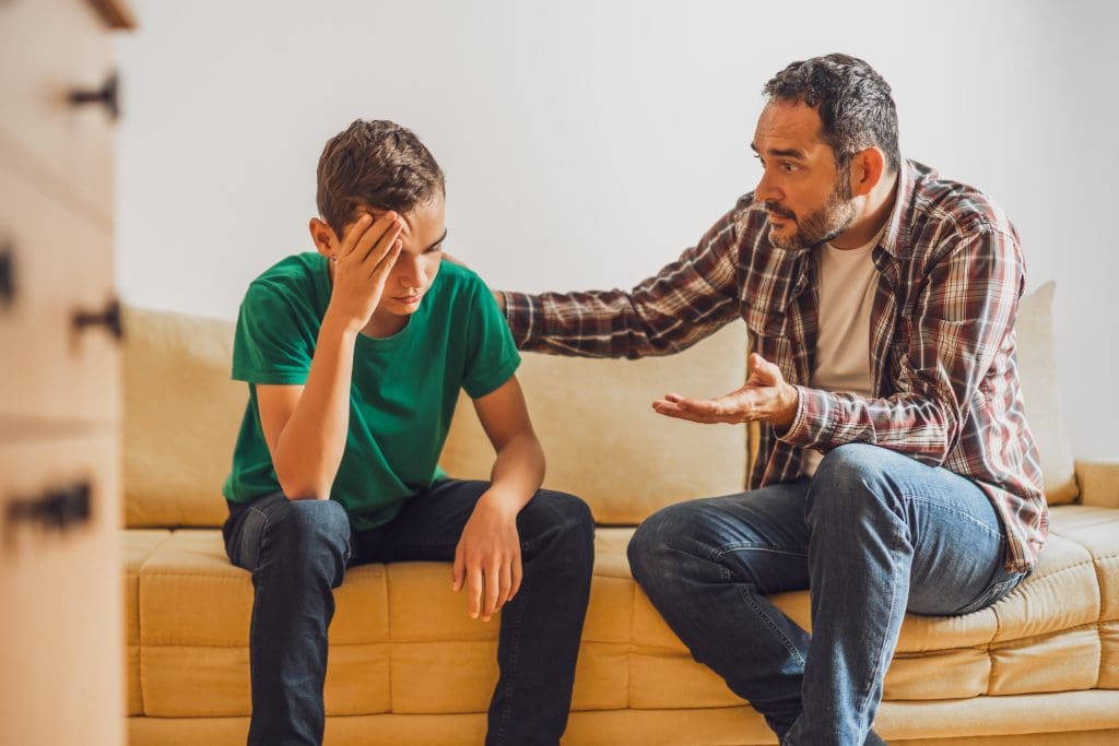 Father talks to teen son who is using alcohol like a drug. 