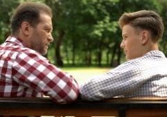 Father and teen son discuss suicide prevention techniques they can use.