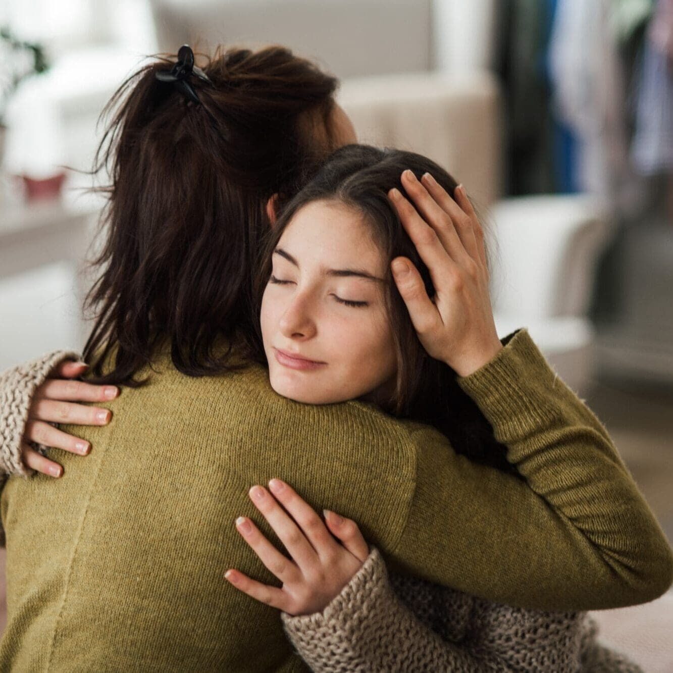 Responsive-mental-health-support Mother and teen embrace after progress at a residential treatment center for adolescents at Embark Behavioral Health.