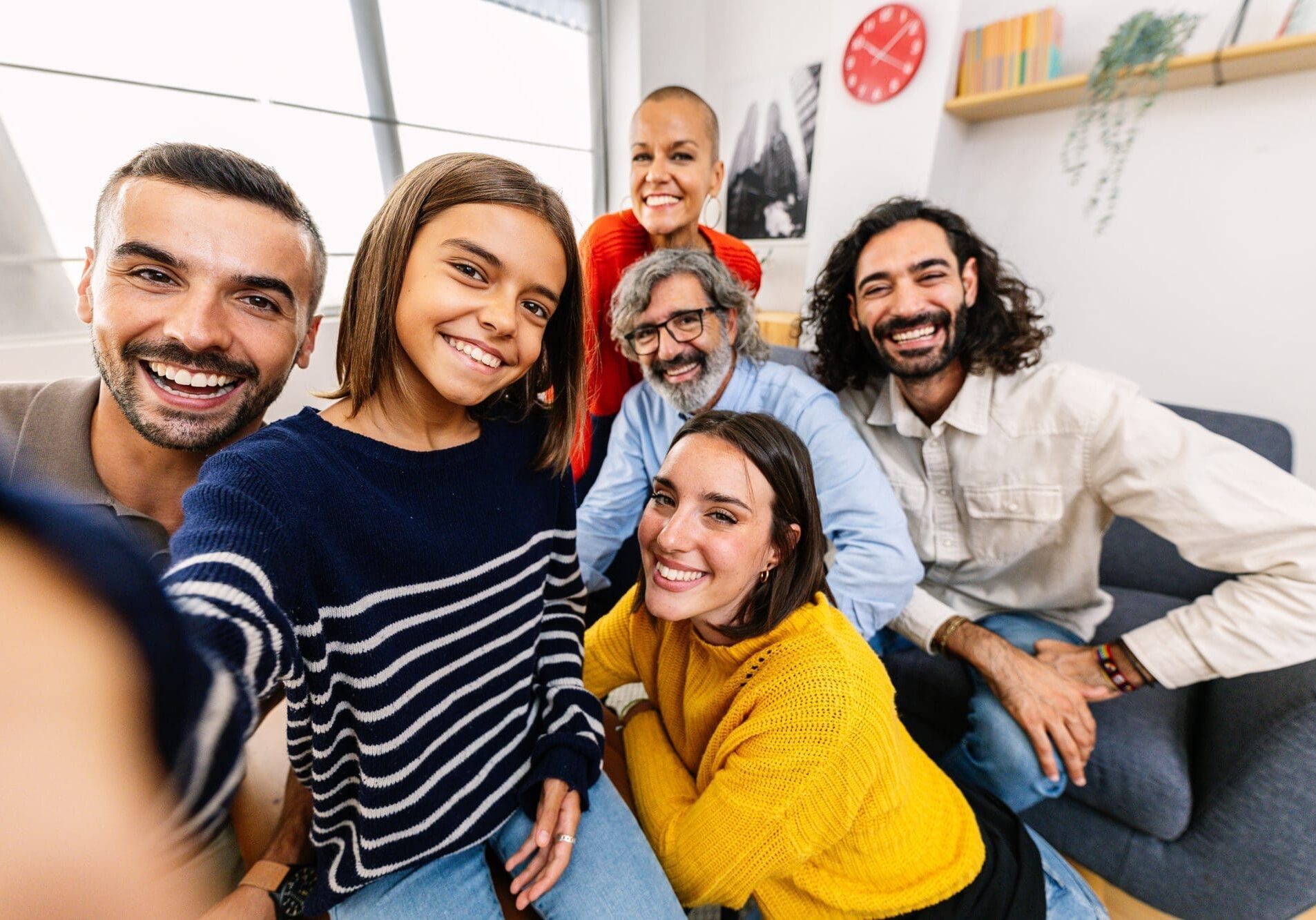 Teen-receiving-mental-health-treatment-at-Embark-Behavioral-Health-takes-a-selfie-with-therapist-and-family-scaled Teen receiving mental health treatment at Embark Behavioral Health takes a selfie with therapist.